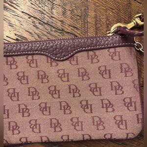 Dooney & Bourke Brown Wristlet. New without tags.